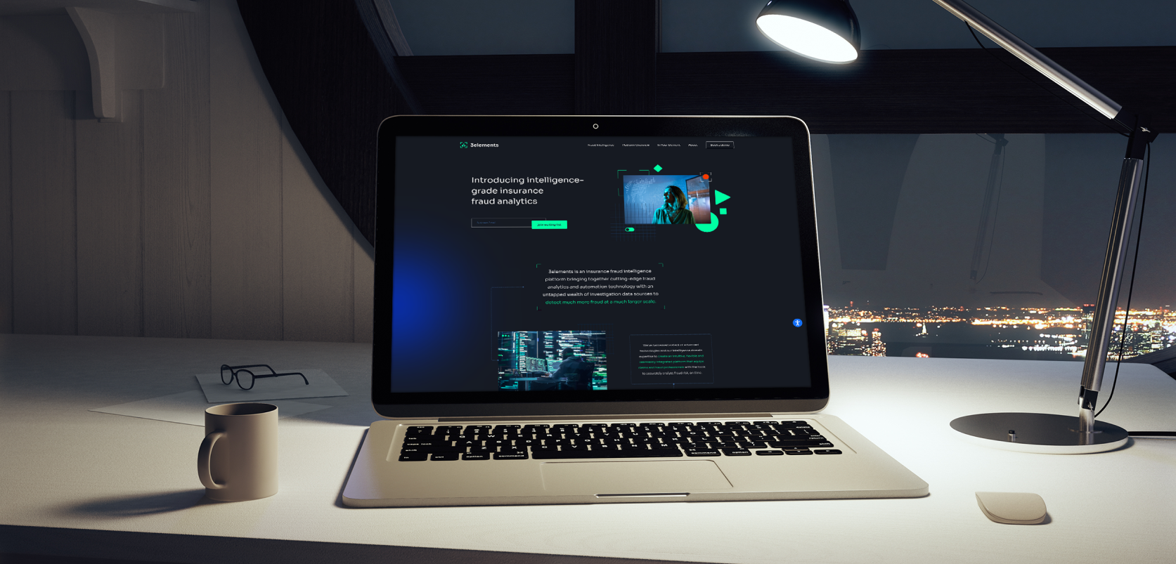 Laptop mockup showing 3elements.ai fraud analytics website on a desk at night